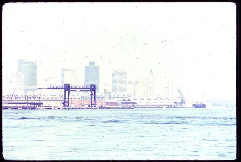 Clean Air Zones Reviewed as Traffic Patterns Shift city skyline visible through hazy air